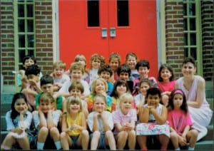 Emily and me in our first grade class picture (both in pink, on the right)